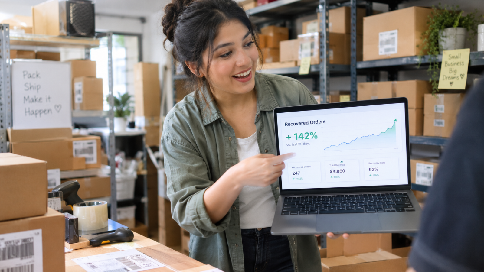 Business owner pointing at recovered orders after adding advanced Wix Velo for eCommerce features