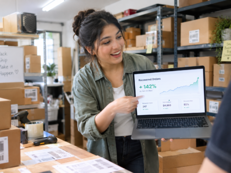 Business owner pointing at recovered orders after adding advanced Wix Velo for eCommerce features
