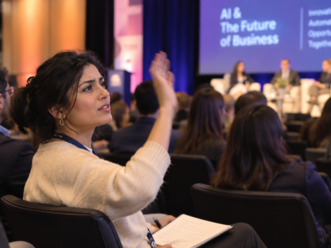 Business owner asking whether superintelligence is the future of AI at a tech conference panel